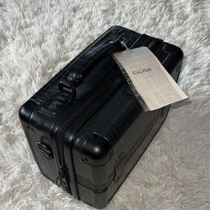 Calpak Black Embossed Travel Bag